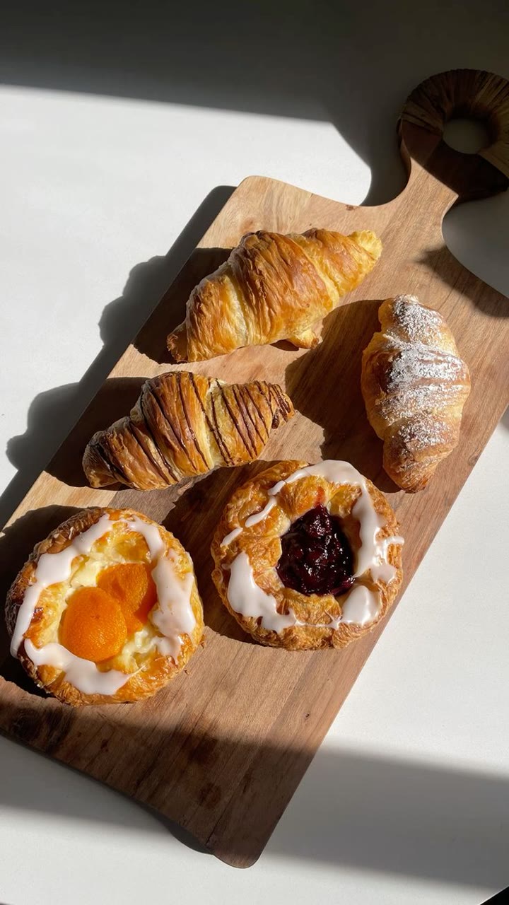 Pastries arranged in warm window light