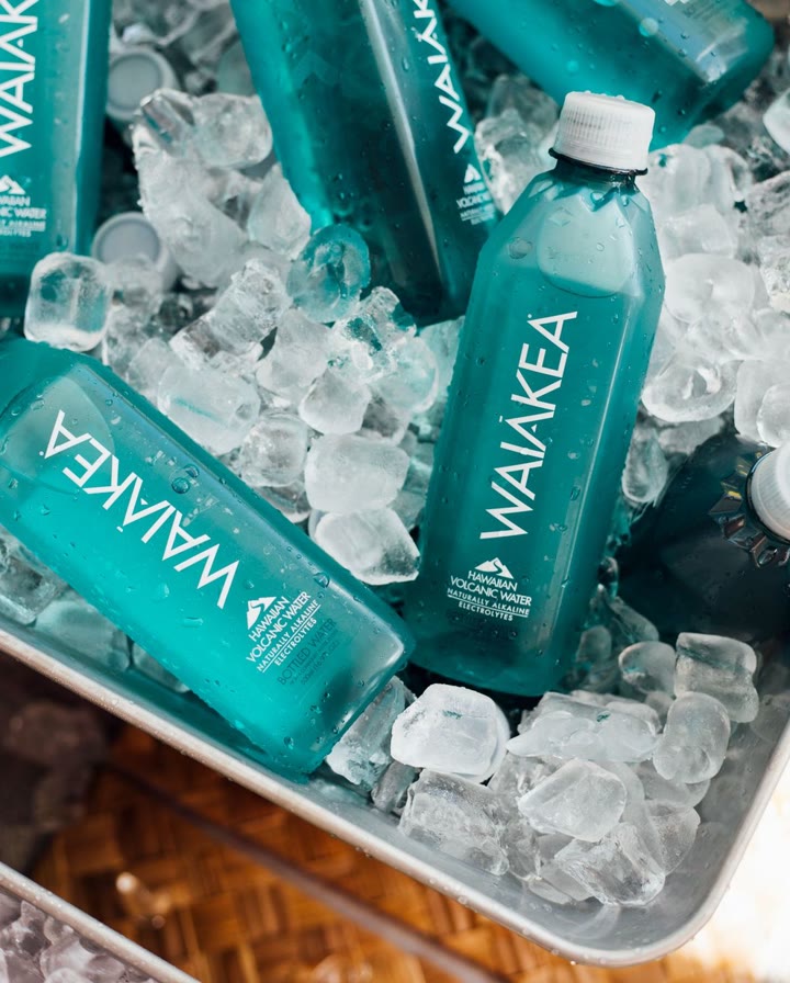 Waiakea water bottles nestled in ice